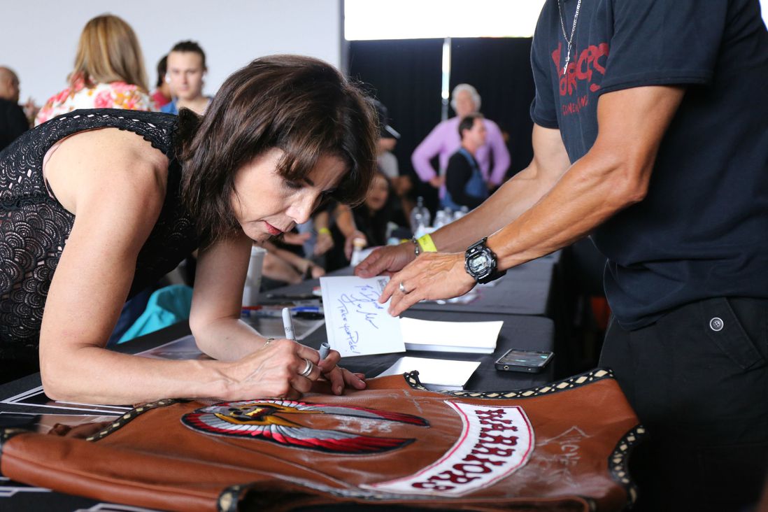 Lisa Mauer of The Lizzies signs a fan's vest<br/>